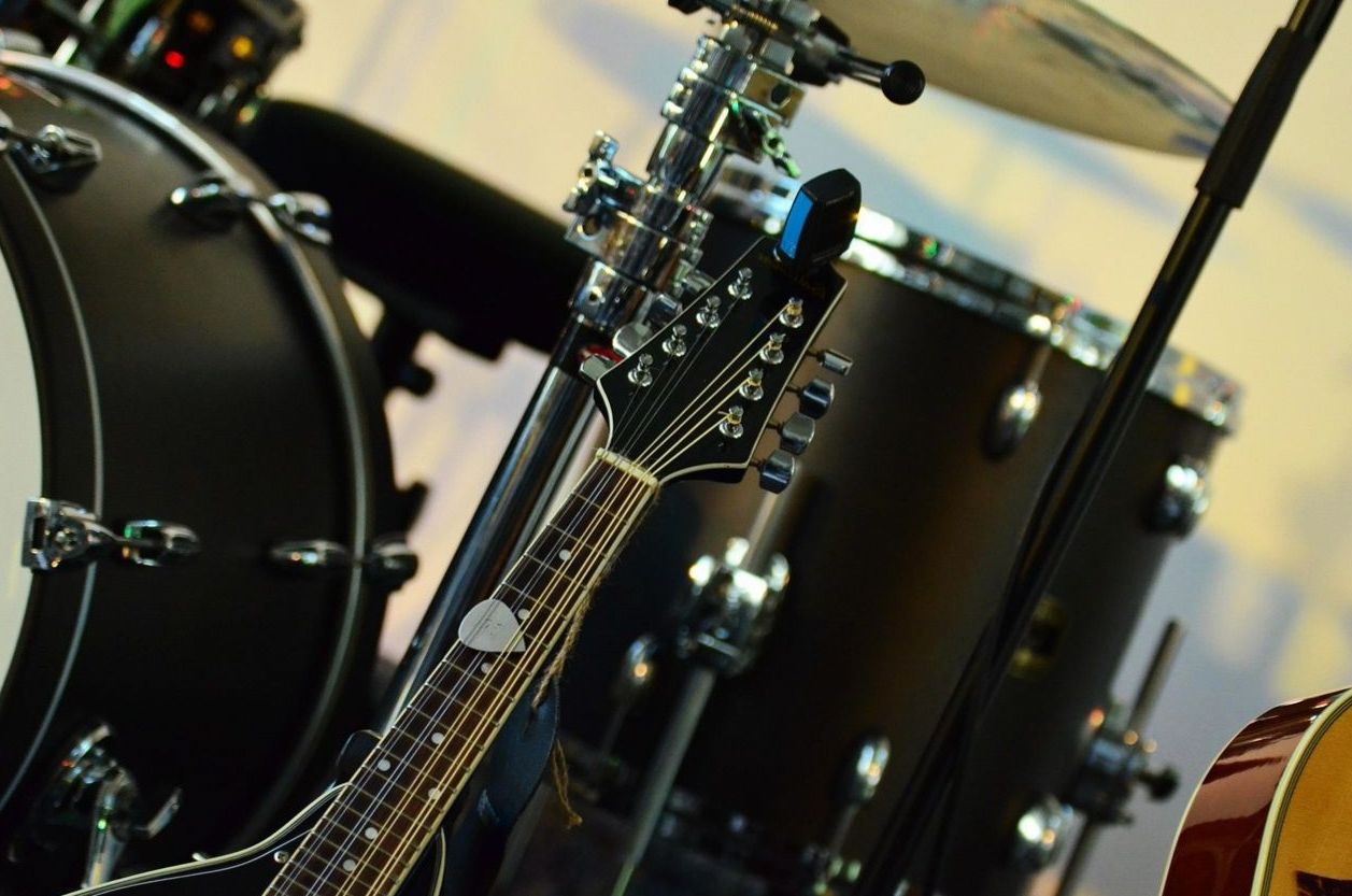 Guitar and drum kit in a music store