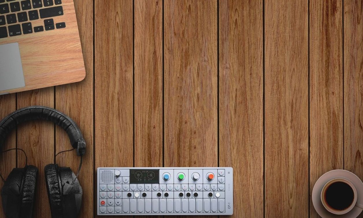 Home recording studio setup with synthesizer and headphones