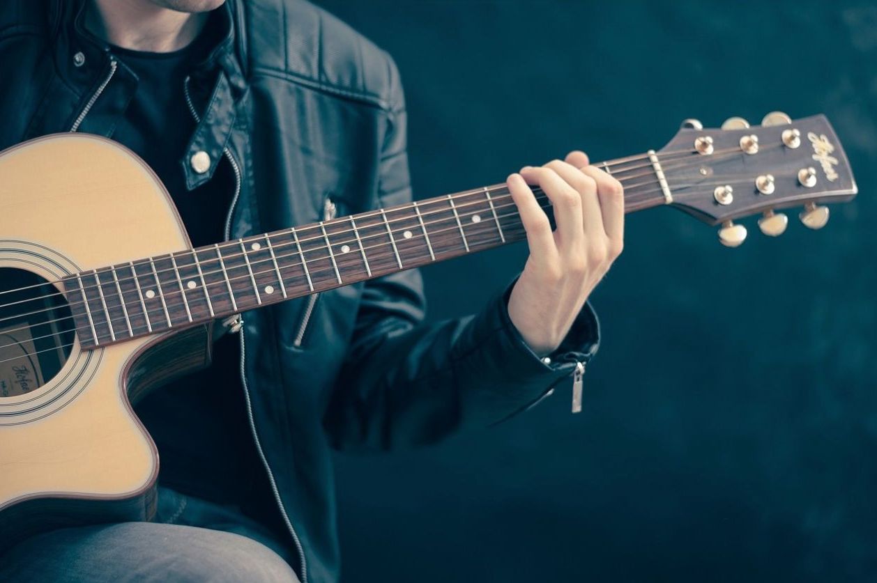 Acoustic guitar being played